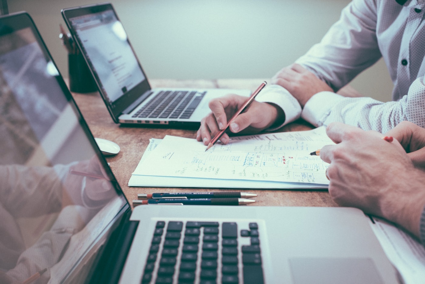 Financial reporting and planning documents on a desk